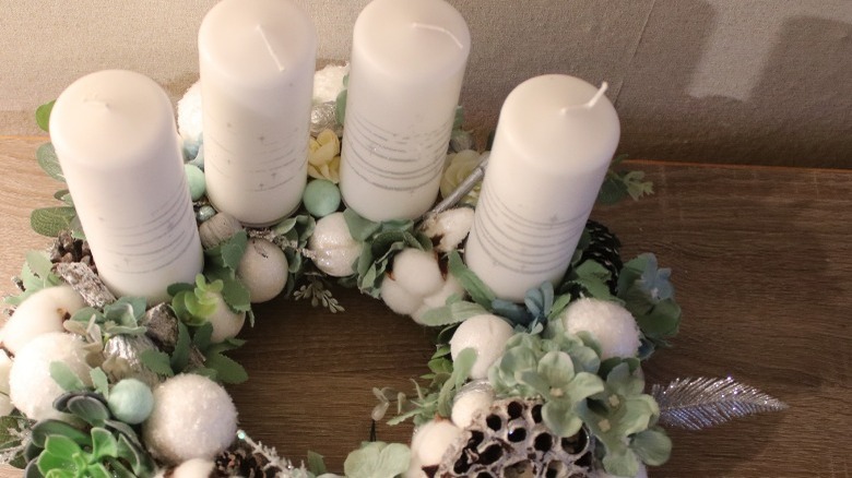 Pillar candles on wreath