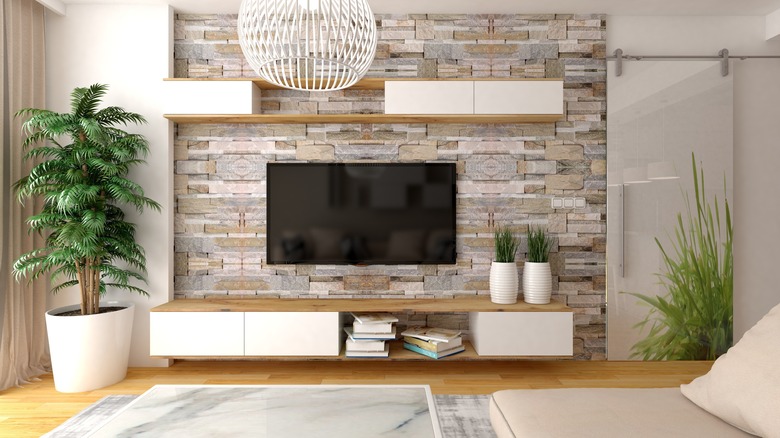 living room with stone wall