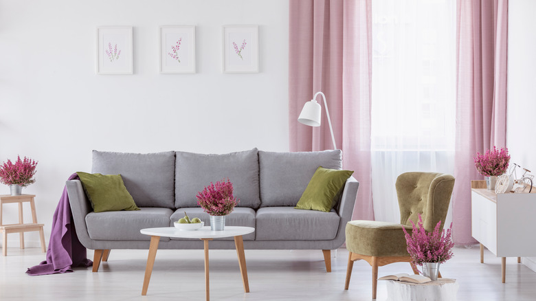 living room with pinky-purple curtains