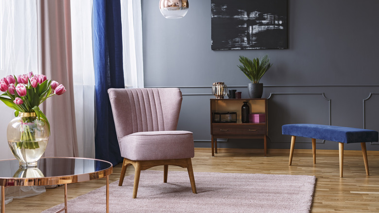 living room with pink chair