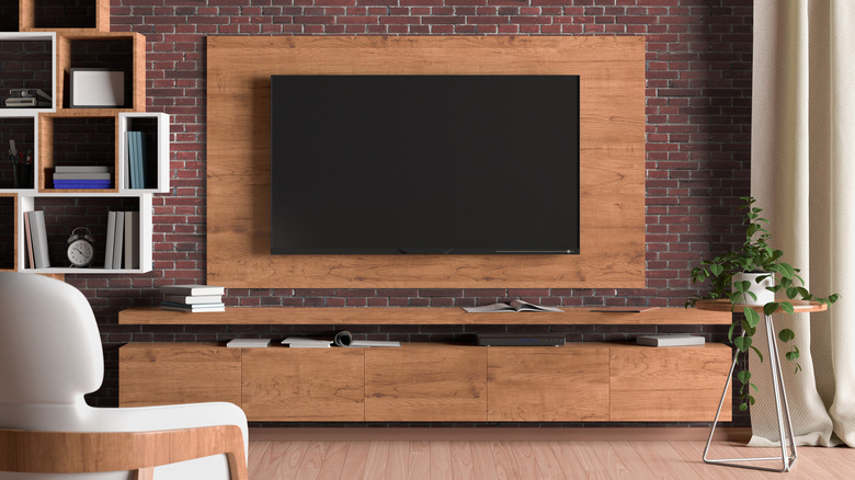 wood backing behind a television