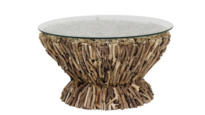 Round coffee table with pieces of wood on the base