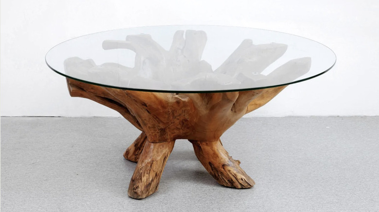 Glass coffee table with wooden support