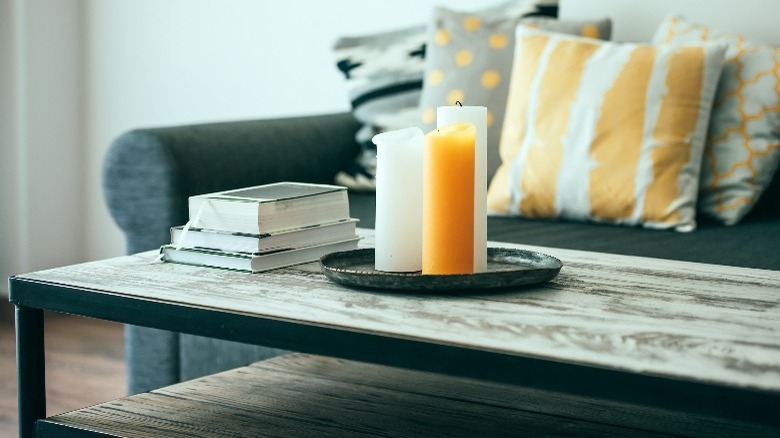 Books and candles on coffee table
