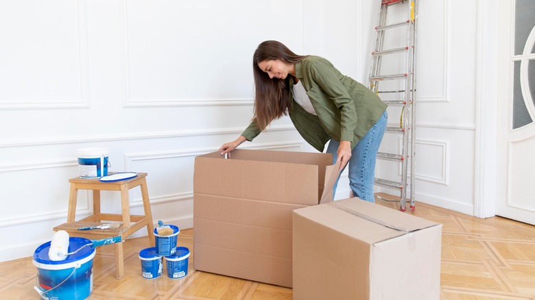 woman opening box during renovation