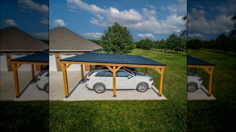 cedar carport and white SUV