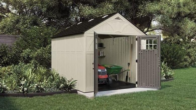 tan shed in yard