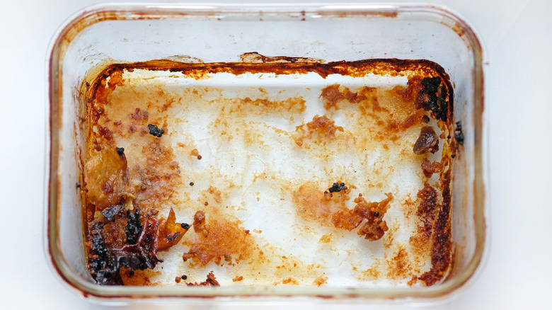 Glass dish with burnt food