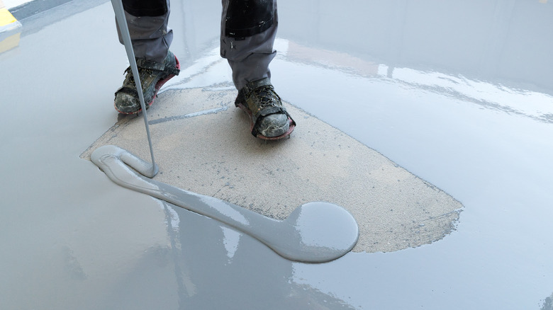 pouring sealant onto floors