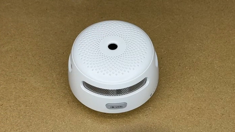 X-Sense smart smoke alarm on counter