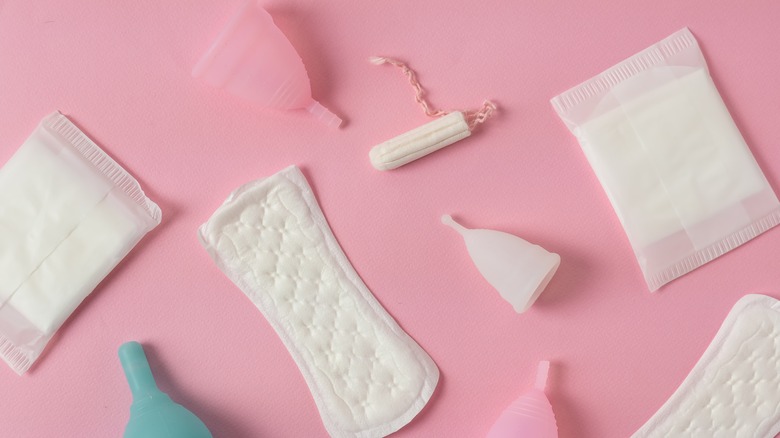 feminine products on pink background