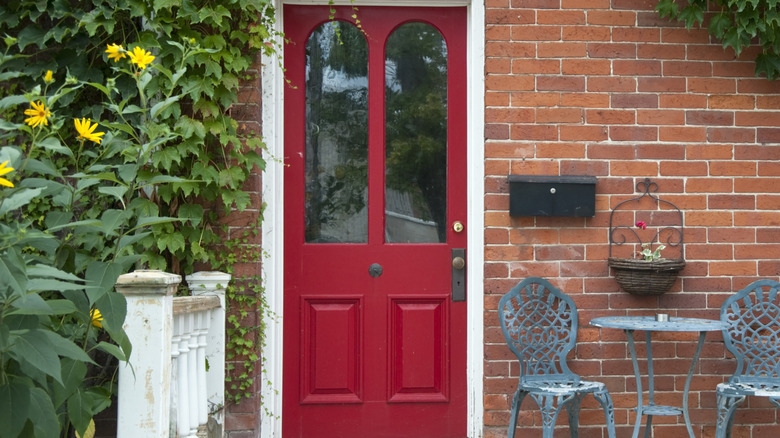 Brick home with a red front door