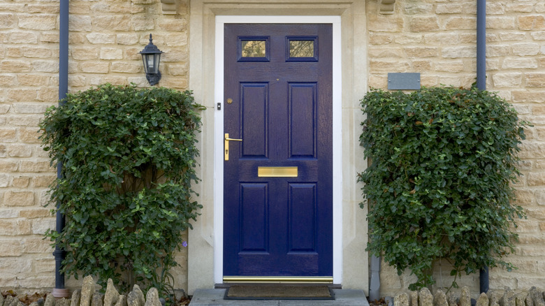 Brick house with a dark blue front door