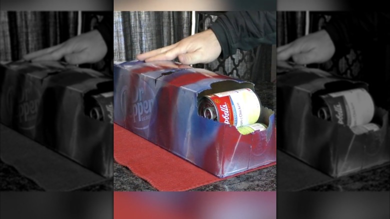 an old soda box being used to store canned goods