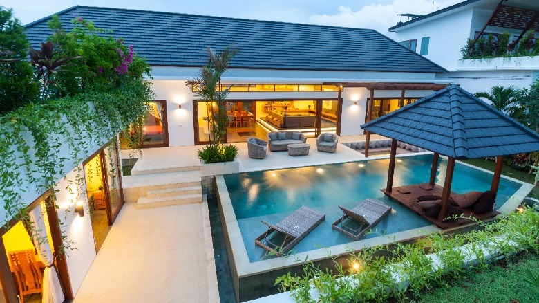 Pool with lounge chairs and deck