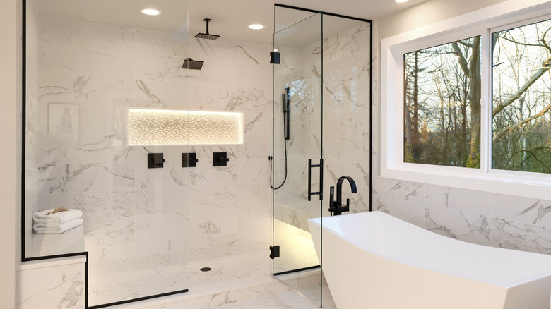 White bathtub and marble shower