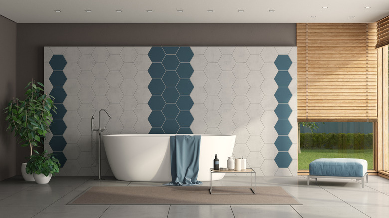 Modern bathroom with tiled wall
