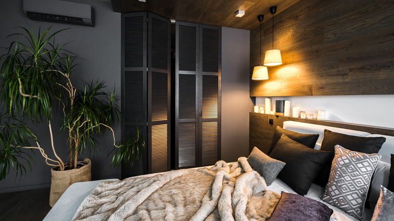 bedroom with black closet doors