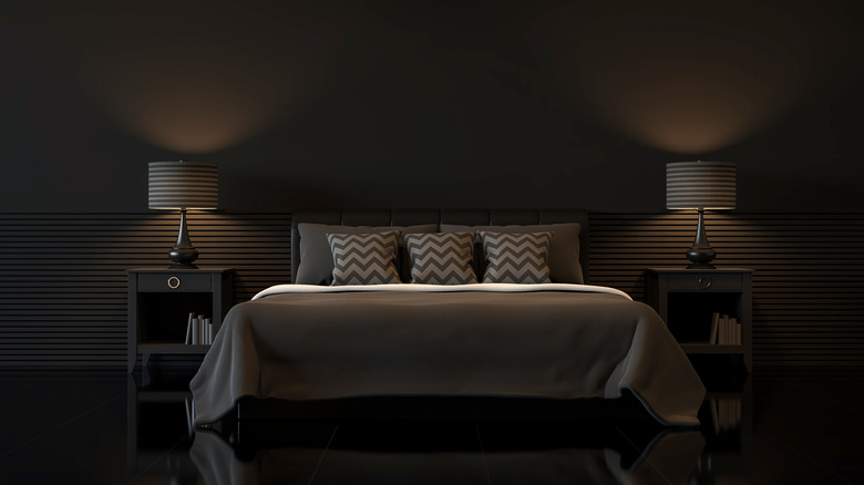 black bedroom with moody lighting