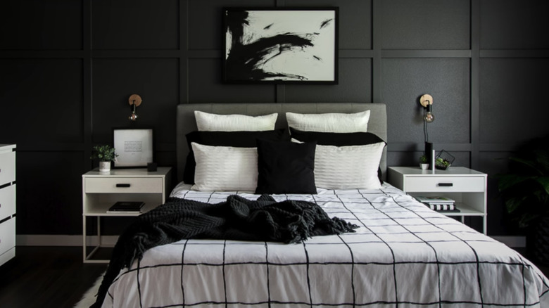 black bedroom with white furniture