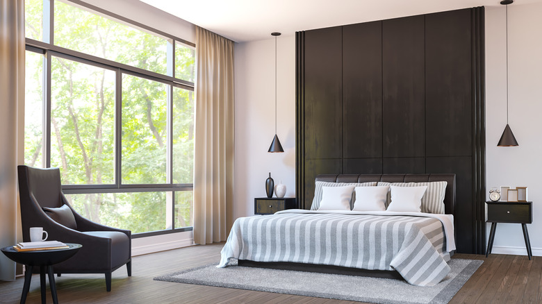 black bedroom with large window