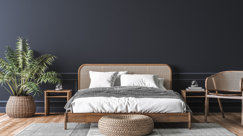 black bedroom with rattan furniture