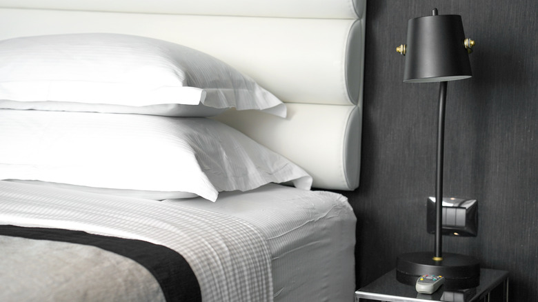 black bedroom with white headboard