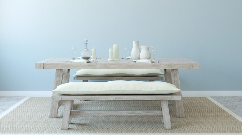 whitewashed table and benches