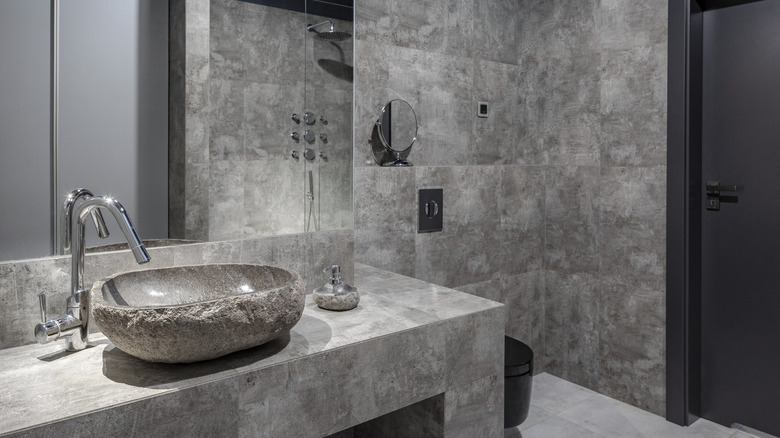 bathroom with a stone sink