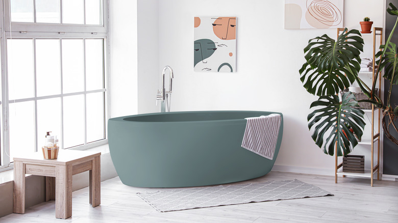 bathroom with a green bathtub