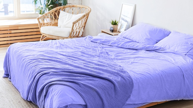 purple linen on a bed