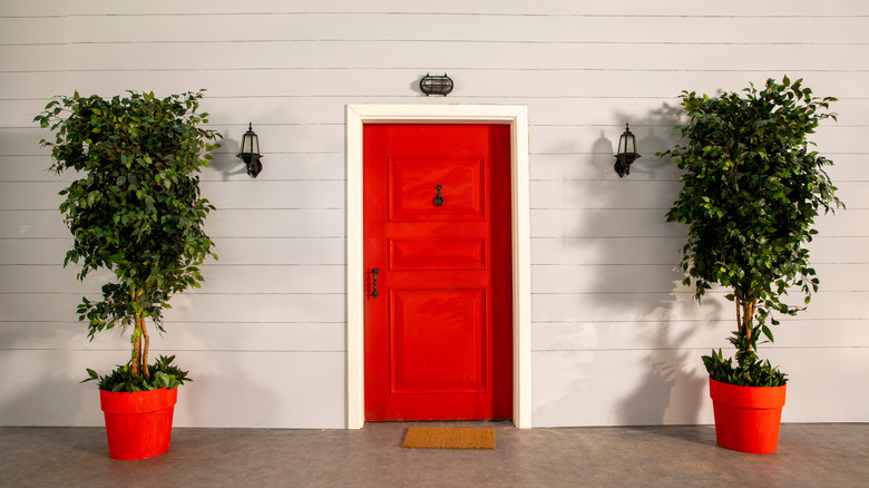 pretty porch with red planters 