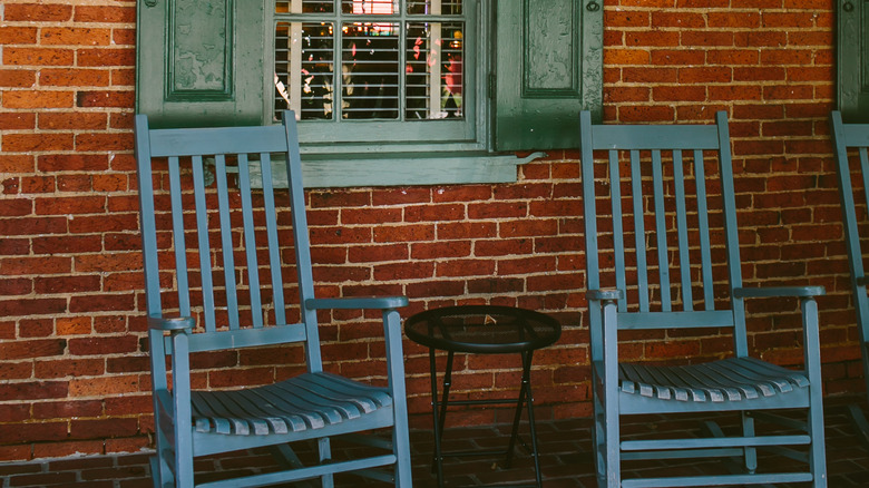 porch with blue rocking chairs 