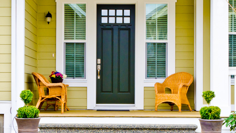 Yellow home with beautiful porch 