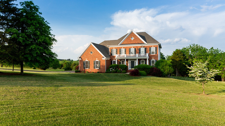 lawn and brick mansion