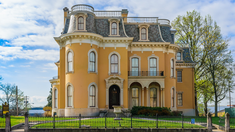 yellow mansion with mansard roof