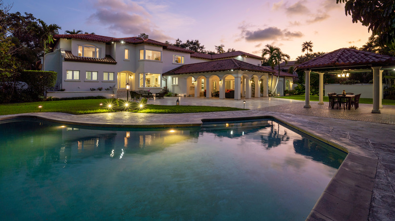 mansion and pool in evening light