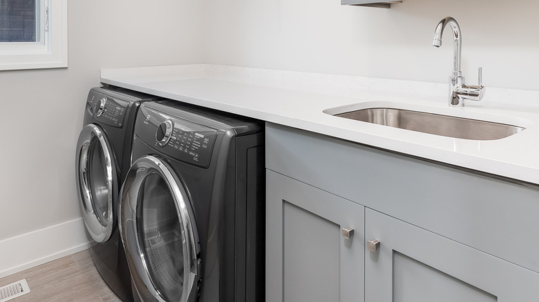 laundry room with granite countertops 