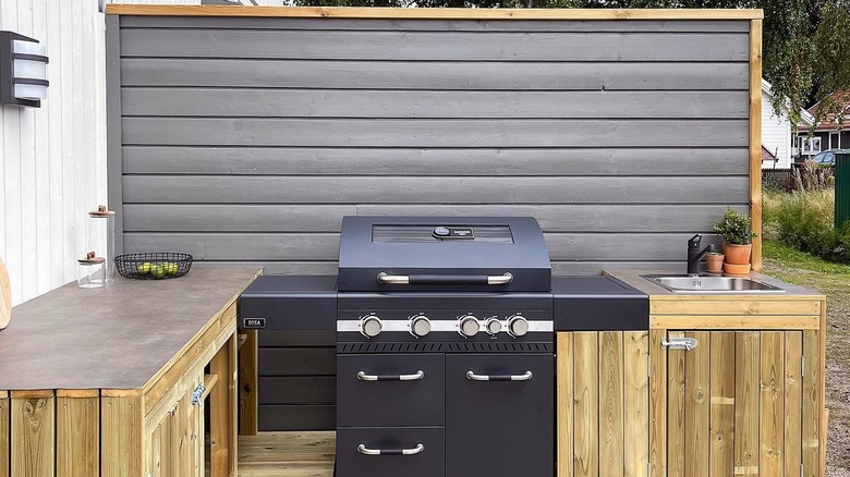 Outdoor kitchen with wooden cabinets