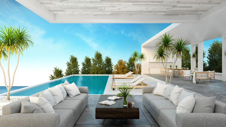 two gray couches by pool