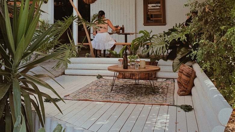 white patio with boho rug