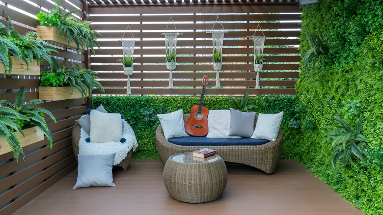 patio with green plant wall