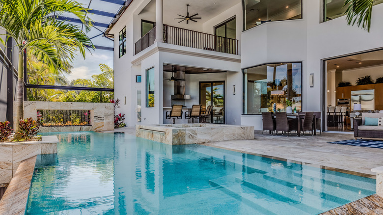 enclosed pool behind a house