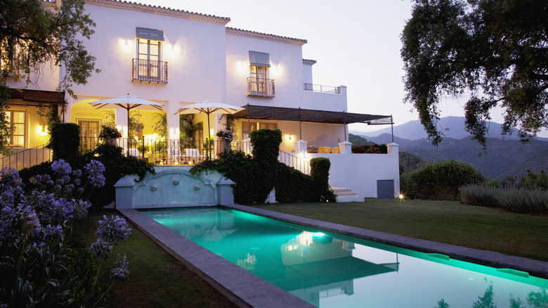 villa-like home with a pool