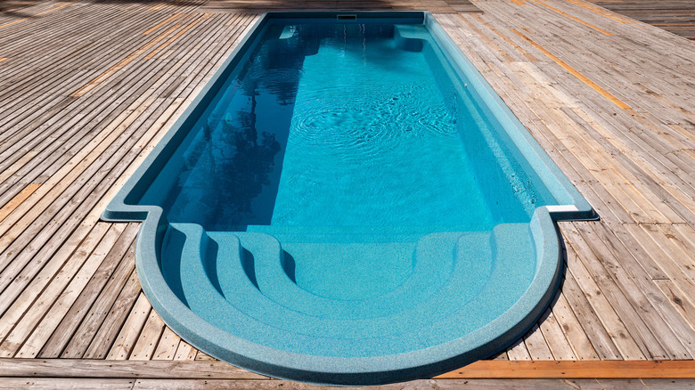 fiberglass pool with wood deck