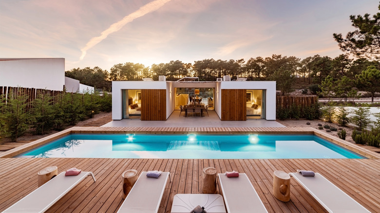 pool surrounded by wood patio