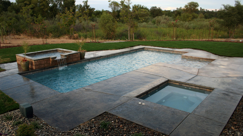 pool surrounded by stone slate