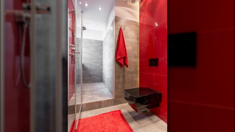 Red accent walls bathroom shower