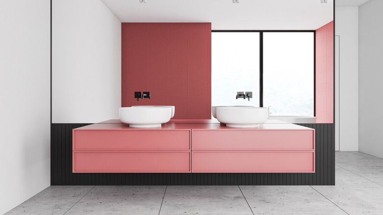 Blush red sink cabinets