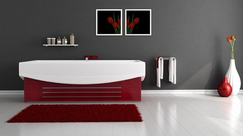 Dark red bathtub gray bathroom